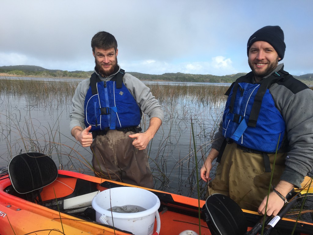 NGT intern Liam Turner (left) and volunteer Luke Albury (right) take time out for a photo in between measuring fish at Lake Moniboeng. 