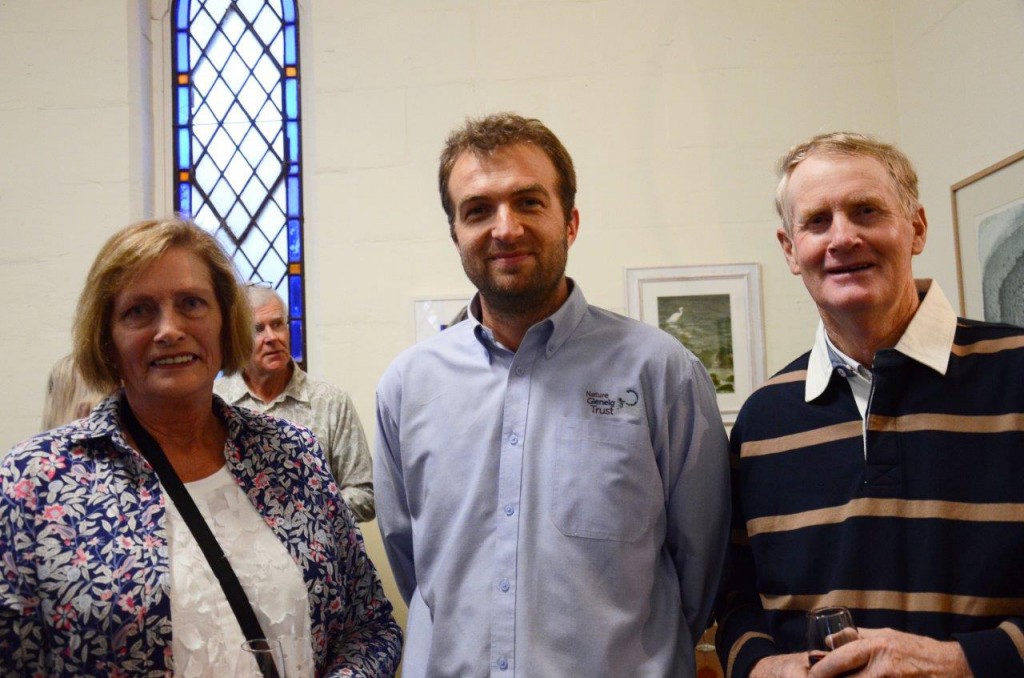 The previous owners of Mt Burr Swamp, Helen and Neil Ellison, with Nature Glenelg Trust Manager Mark Bachmann (centre) at the Cross Border Art Exhibition. Photo by Jocelyn Nickels of the Border Watch. 